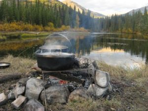 pots on grill over fire